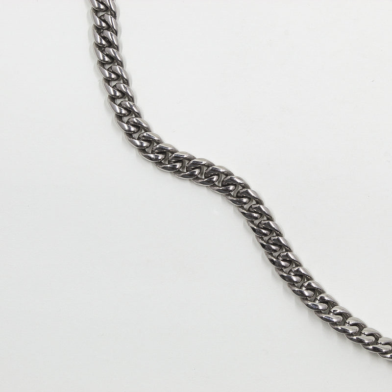 silver cuban link chain displayed in a pattern